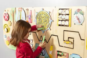 kid plays with sensory wall for autism kid plays with sensory wall for autism